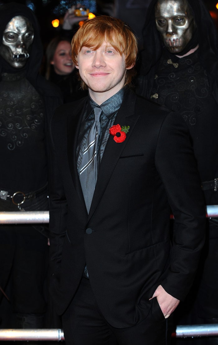 Rupert Grint aka Ron Weasley is unfazed by the Death Eater attention behind him