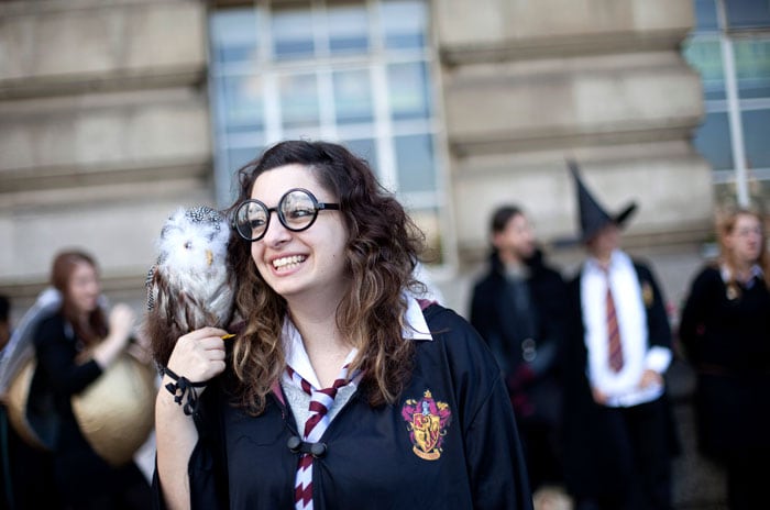 <i>Harry Potter</i> fan Sonia Ioannou poses for a photograph along with others at London's South Bank.