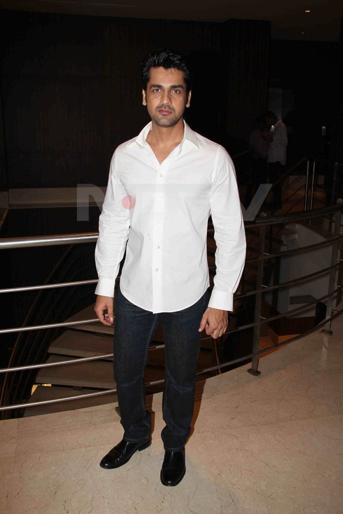 Arjan Bajwa sticks with the classic white shirt.