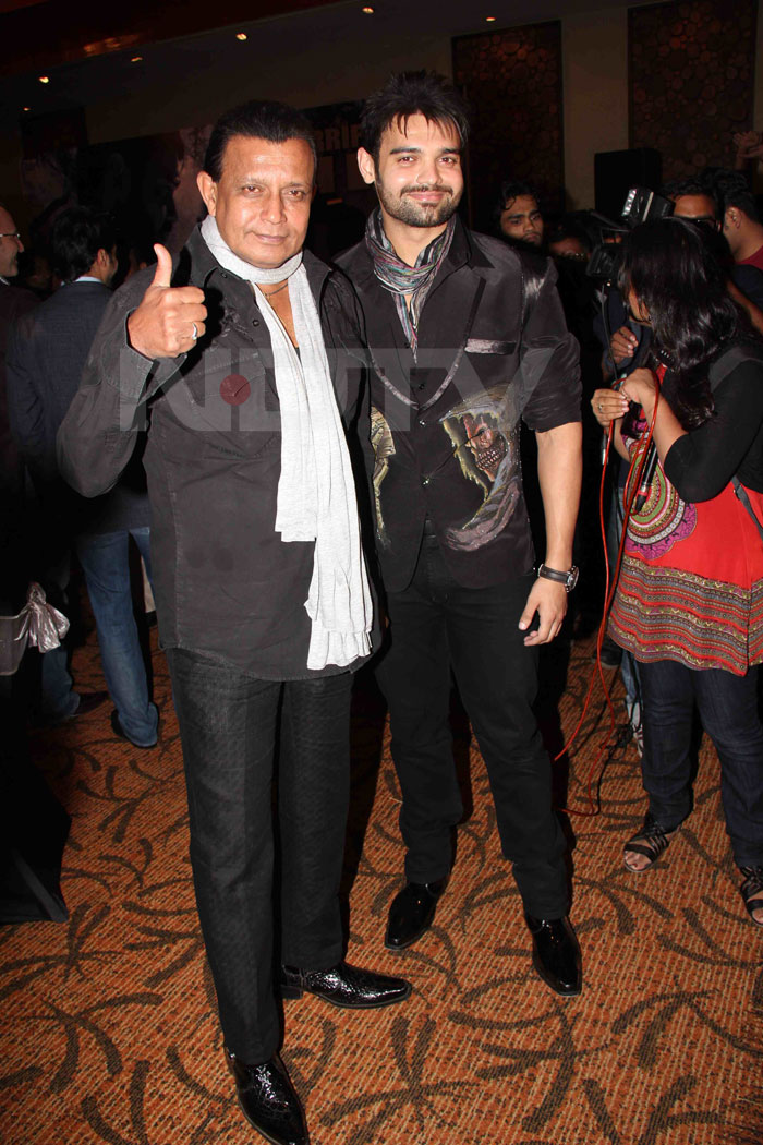 Proud papa Mithun poses with his son.