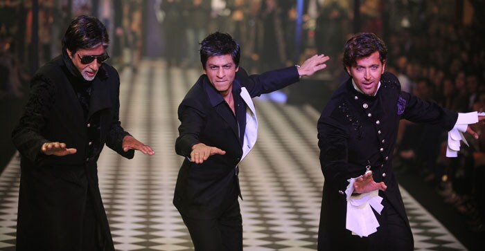 Amitabh Bachchan, Hrithik Roshan and Shah Rukh Khan dazzled as the showstoppers for Karan Johar and Varun Bahl's show at the HDIL-India Couture Week.(Photo: AFP)