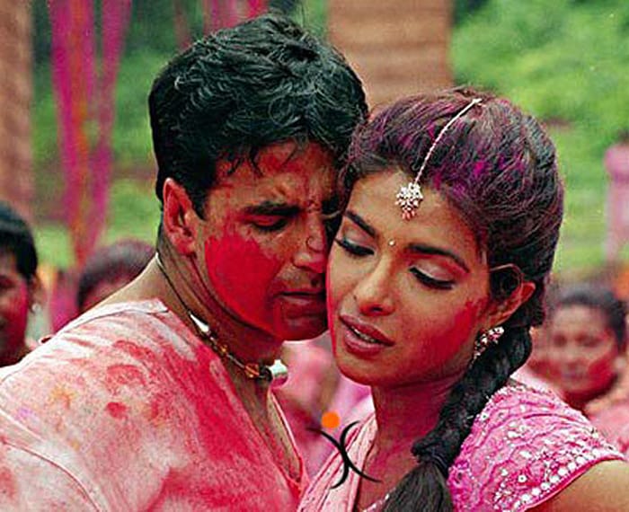 <i>Do Me A Favour Let's Play Holi</i> from <i>Waqt- A Race Against Time</i> (2005)<br><br>
Singer: Anu Malik, Sunidhi Chauhan<br><br>
Actors: Akshay Kumar, Priyanka Chopra, Amitabh Bachchan