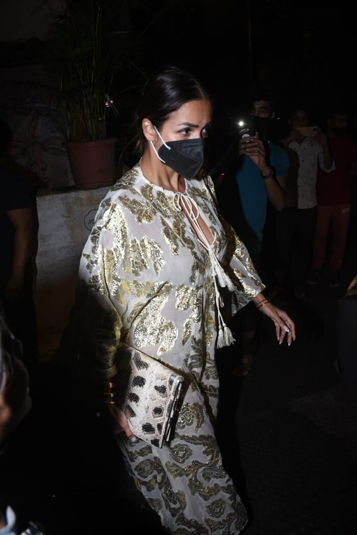 Malaika Arora and Sonam Kapoor were photographed at the Pali Village Cafe in Bandra on Monday. Malaika looked gorgeous in an ivory-toned kaftan.