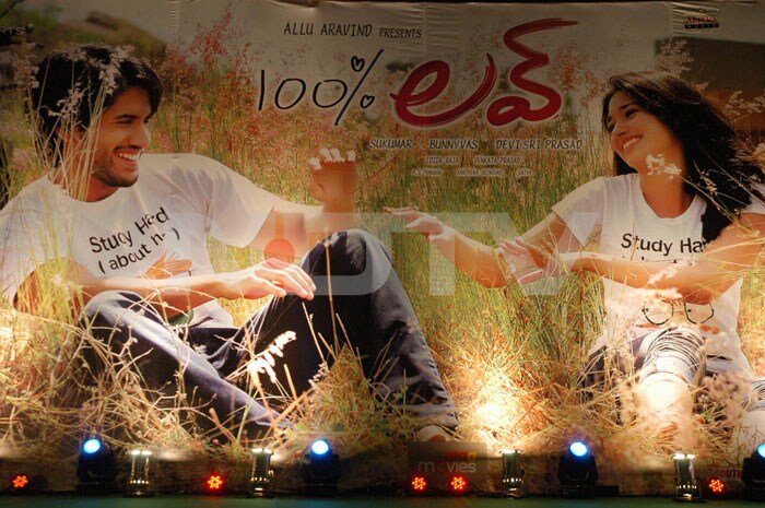 A poster of <i>100 % Love</i> starring Tamanna and Nag Chaitanya .