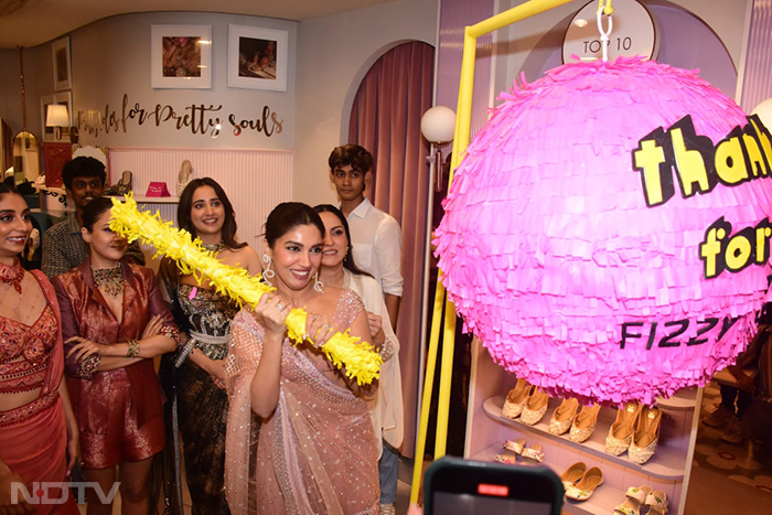 A scene from <i>Thank You For Coming</i> promotions - picture-perfect Bhumi Pednekar and a pinata. (Image courtesy: Varinder Chawla)