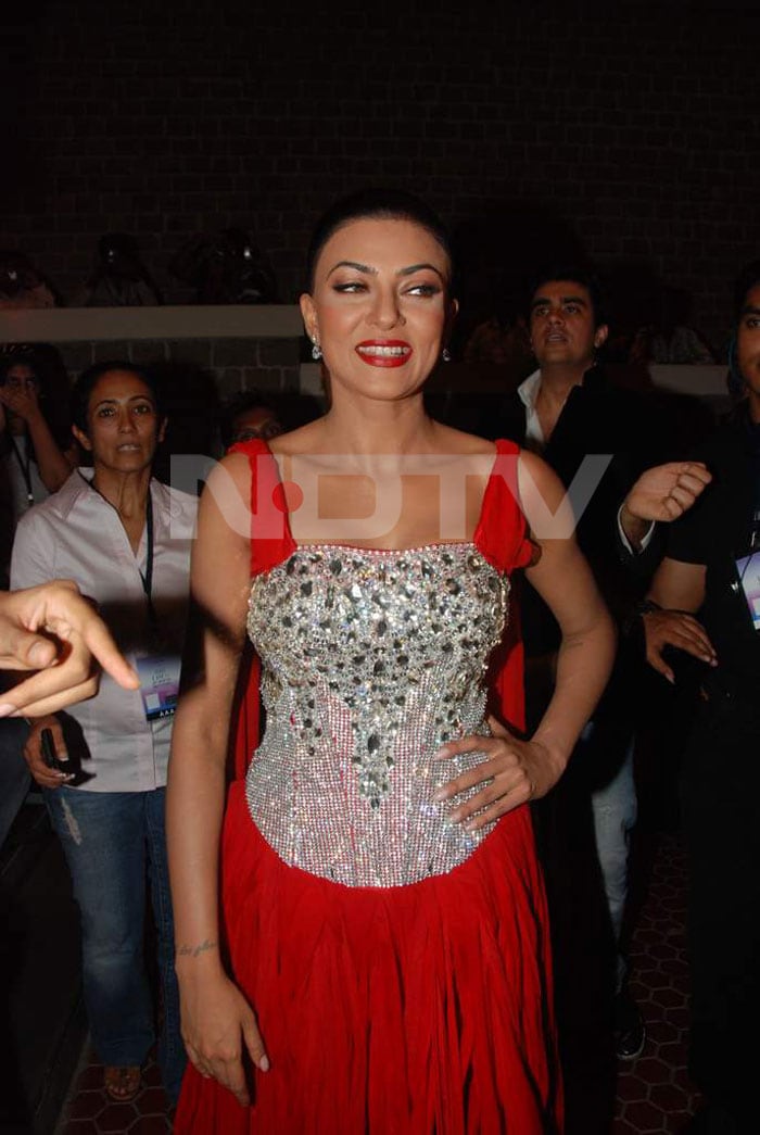 Sushmita in a red outfit.