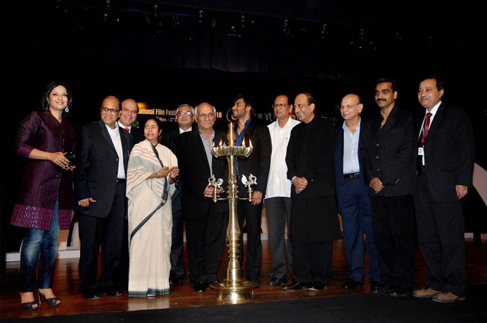 Union Railways Minister Mamata Banerjee, Goa Chief Minister Digambar Kamat, Bollywood director Yash Chopra, actor Ajay Devgn and others pose for a group photograph during the inauguration of the 41st International Film Festival of India. (Photo: PTI)
