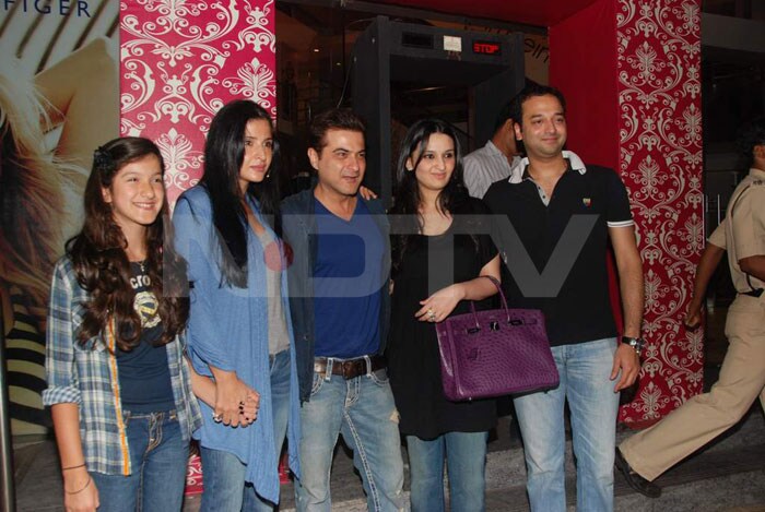 Sanjay Kapoor poses for the cameras with wife Maheep Kapoor, daughter Shania and socialites Sunny and Anu Dewan.