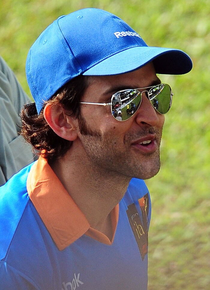 Hrithik Roshan smiles at fans during a cricket match between Indian Bollywood actors and Sri Lankan cricketers during the three-day International Indian Film Academy (IIFA) awards events in Colombo on June 4, 2010.