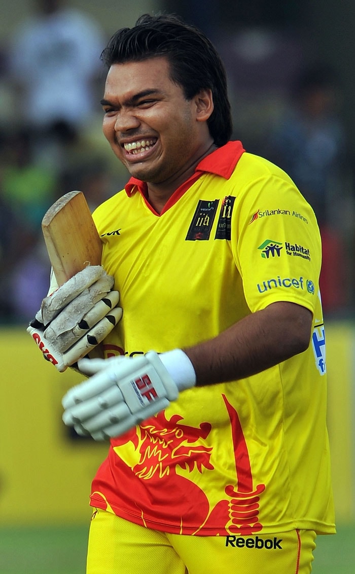 Namal Rajapakse (L), son of Sri Lankan President Mahinda Rajapakse, smiles during a cricket match between Indian Bollywood actors and Sri Lankan cricketers during the three-day International Indian Film Academy (IIFA) awards events in Colombo on June 4, 2010.