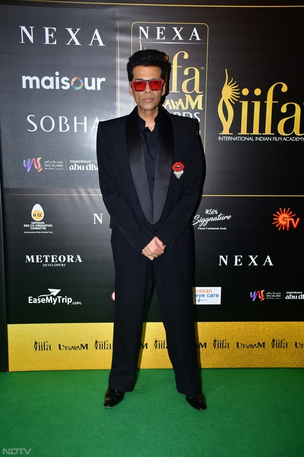 Karan Johar, the King of red and green carpets, added a fun accent to his all-black look. (Courtesy: Varinder Chawla)