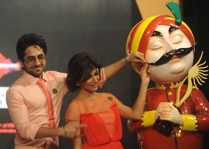 A twirl of the maharaja's moustache from Ayushmann and Chitrangda, the hosts of this year's IIFA Rocks.