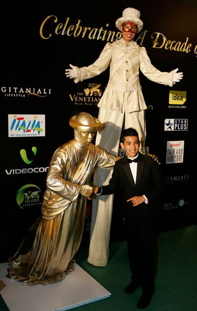 Bollywood actor Tanay Chheda poses on the green carpet. (Photo: AP)