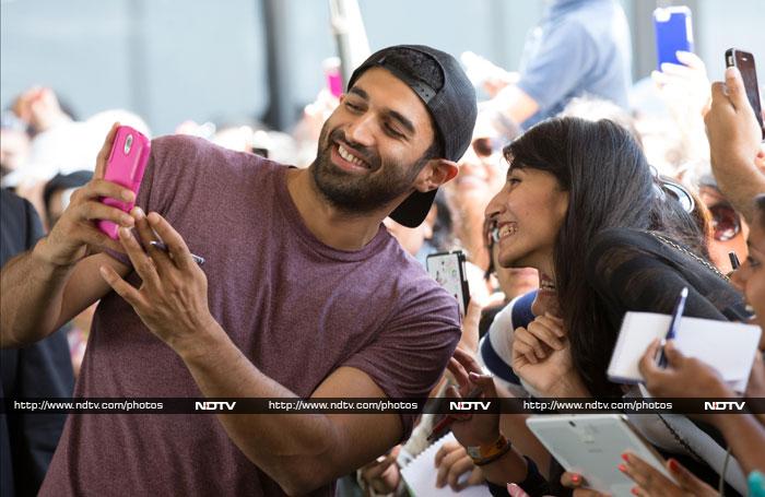 Like Hrithik, actor Aditya Roy Kapur was also spotted posing for a selfie, pen clutched in hand for autograph-signing.