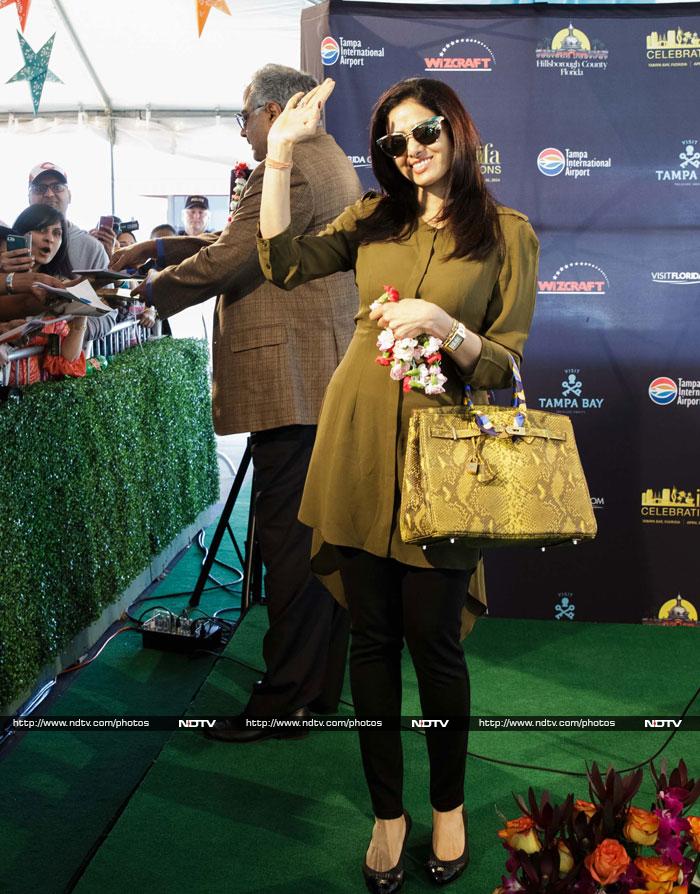 The trip from Bollywood to Tampa Bay is a long and tiring but IIFA seems to have found a solution for the weariness. Arriving stars are greeted by a crowd so infectiously energetic that any jet lag disappears instantly. <br><br> Sridevi, looking svelte and youthful, waved cheerfully at her fans as she touched down.