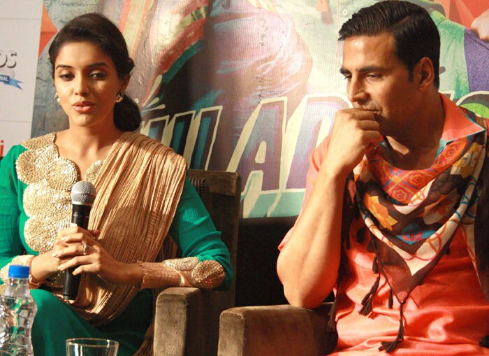 Akshay in a thoughtful mood as Asin speaks to the media.