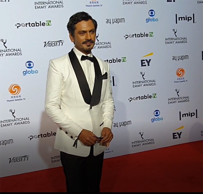 Nawazuddin Siddiqui was looking dashing in a white shirt, a white blazer and black trousers.