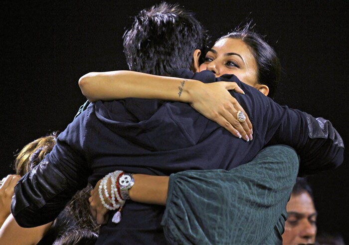 Actors Shah Rukh Khan and Sushmita Sen greet each other before the start of the IPL T20 match between Kolkata Knight Riders and Deccan Chargers at Eden Gardens in Kolkata on Thursday. (PTI Photo)