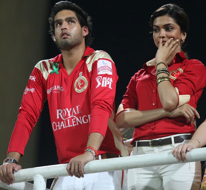 Siddharth Mallya, son of Royal Challengers Bangalore owner Vijay Mallya, and actress Deepika Padukone watch from the stands during the 2010 DLF Indian Premier League T20 semi final match between Mumbai Indians and Royal Challengers Bangalore played at DY Patil Stadium on April 21, 2010 in Navi Mumbai, India. (Photo: IPL2010/Getty Images)