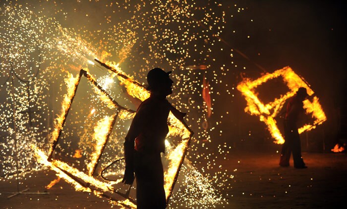 Artists perform during the International Fire Fest in Kiev late on June 12, 2010. Artists from Germany, Finland, Hungary, Israel, Russia, Lithuania, Sweden, Ukraine and others took part in the annual fire performance. (Photo: AFP)