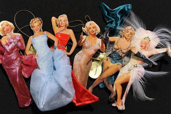 A group of seven Marilyn Monroe enamel five-inch tall enamel ornaments with added fabric, rhinestones or other 3D details by The Bradford Exchange (est.$100-$125) is on display at a preview of Bonhams & Butterfields 'Legends and Goddesses' entertainment memorabilia auction, on June 11, 2010 in Los Angeles. (Photo: AFP)