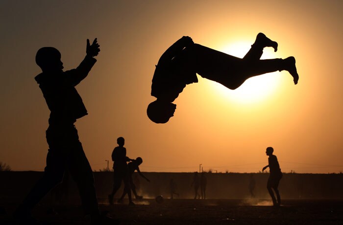 South African youngsters show off their football goal scoring celebration skills on a dusty pitch next to the New Zealand All Whites team training venue at Sinaba Stadium, Daveyton, Johannesburg, South Africa, on Tuesday, June 8, 2010. (Photo: AP)