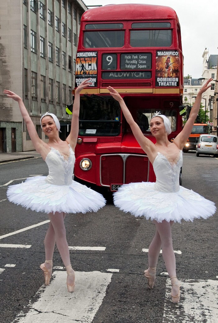 Dancers from the English National Ballet walk across a pedestrian crossing during a photocall to promote the opening of 'Swan Lake in-the-round', which coincides with the company's 60th anniversary, outside the Royal Albert Hall in west London on June 8, 2010. 'Swan Lake in-the-round' runs from 9-19'. (Photo: AFP)