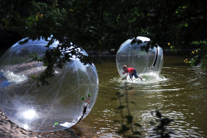 A boy floats in an inflatable sphere at a lake in a park in Sofia on June 13, 2010 as the temperatures registered almost 35 degrees Celsius throughout the Balkan country. (Photo: AFP)