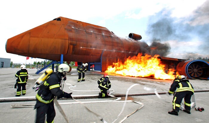 Fire brigades extinguish a fire during an exercise at the Leipzig/Halle airport in eastern Germany on June 7, 2010. They simulated a fire of an airplane and other scenarios. (Photo: AFP)