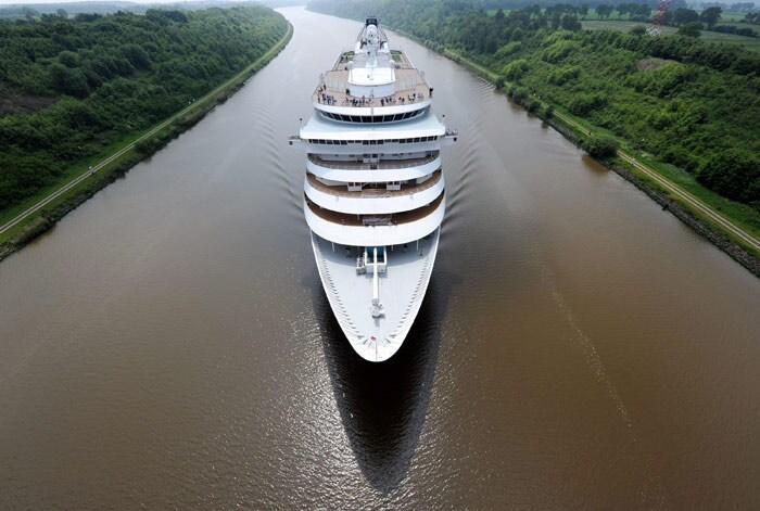 The cruise ship 'Prinsendam' makes its way from Amsterdam to Luebeck up the north Baltic Sea canal near Hanerau-Hademarschen on June 8, 2010. The 205-metre-long ship is operated by the Holland America Line. (Photo: AFP)