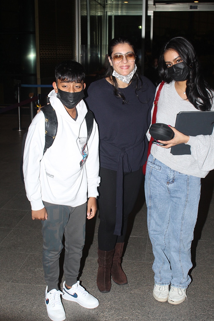 Kajol Poses With Kids Nysa And Yug At The Airport