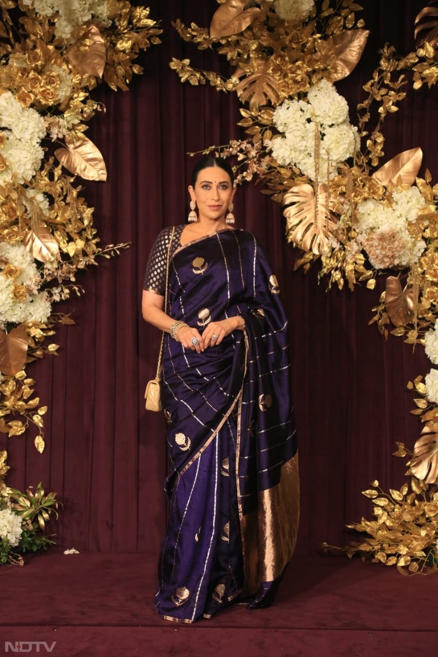 Karisma Kapoor looked gorgeous in a purple saree (Image Courtesy: Varinder Chawla)