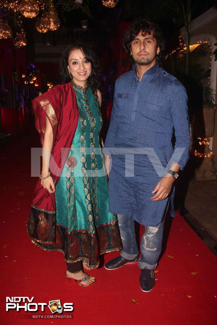 Singer Sonu Niigaam walks in with his wife Madhurima.