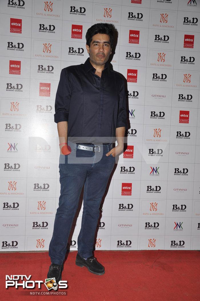 Designer Manish Malhotra posed for the shutterbugs. <br><br>Photo Credit: Santosh Nagwekar