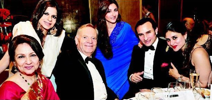 We came across this picture of Bollywood actors Saif Ali Khan and Kareena Kapoor dining with the rest of the Pataudi family at a  charity auction in London hosted by them to raise funds for the new Tiger Eye Hospital. While Saif looked extremely handsome in a black tuxedo, his <i>begum</i> Kareena looked extremely happy to be by his side. Soha Ali Khan looked gorgeous in a blue sari as she posed between her brother Saif and another guest. Her sister Saba looked lovely in a white suit as she posed for a picture next to her mother Sharmila who looked elegant as usual in a fuschia pink sari and really happy with the entire family by her side. <br><br>

<br><br>This picture was posted on Facebook by <a href="https://www.facebook.com/photo.php?fbid=192789827511368&l=b616cbbe15" class="fn fl fa fs12">Bollywood's Biggest Fans Club (BBFC)</a><br><br>


Coming up: Saif and his <i>begum</i>'s London visit