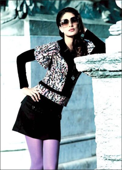 <b>Purple mania</b>: Kareena looks stunning in the black top and purple tights. And with this pic she brings back the favourite pout.(Courtesy: Indiafm.com)