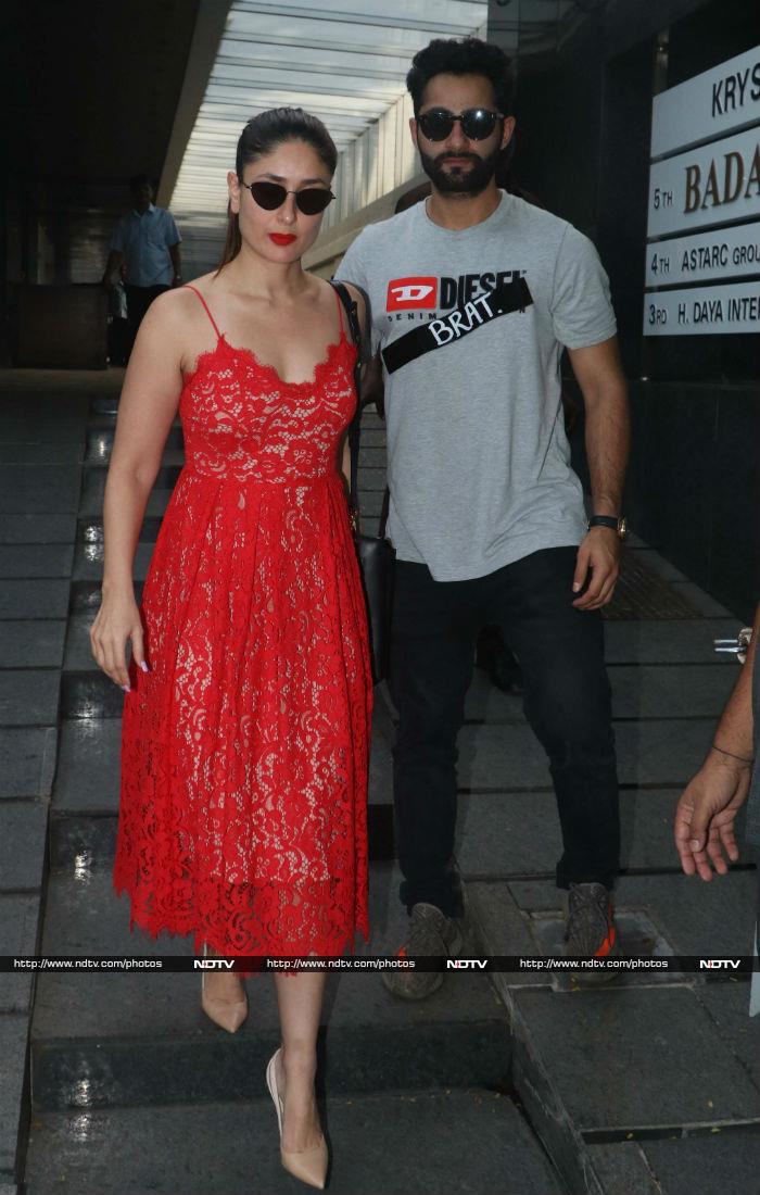 Kareena looked chic in a red strap midi lace dress, which she paired with a red lip clour, black sunglasses and nude pumps.