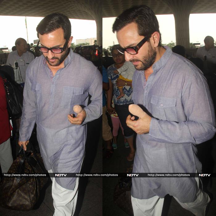 What A Sweetie. Saif Carries Kareena\'s Bag For Her At Airport