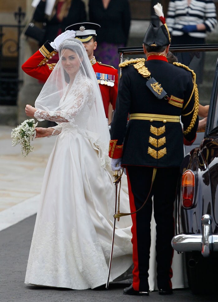 29-year-old Kate Middleton is in a full-sleeved Chantilly lace dress with a strapless slip underneath.