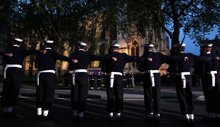 Members of the British Royal Navy straighten their lines outside Westminster Abbey. (Photo: AP)