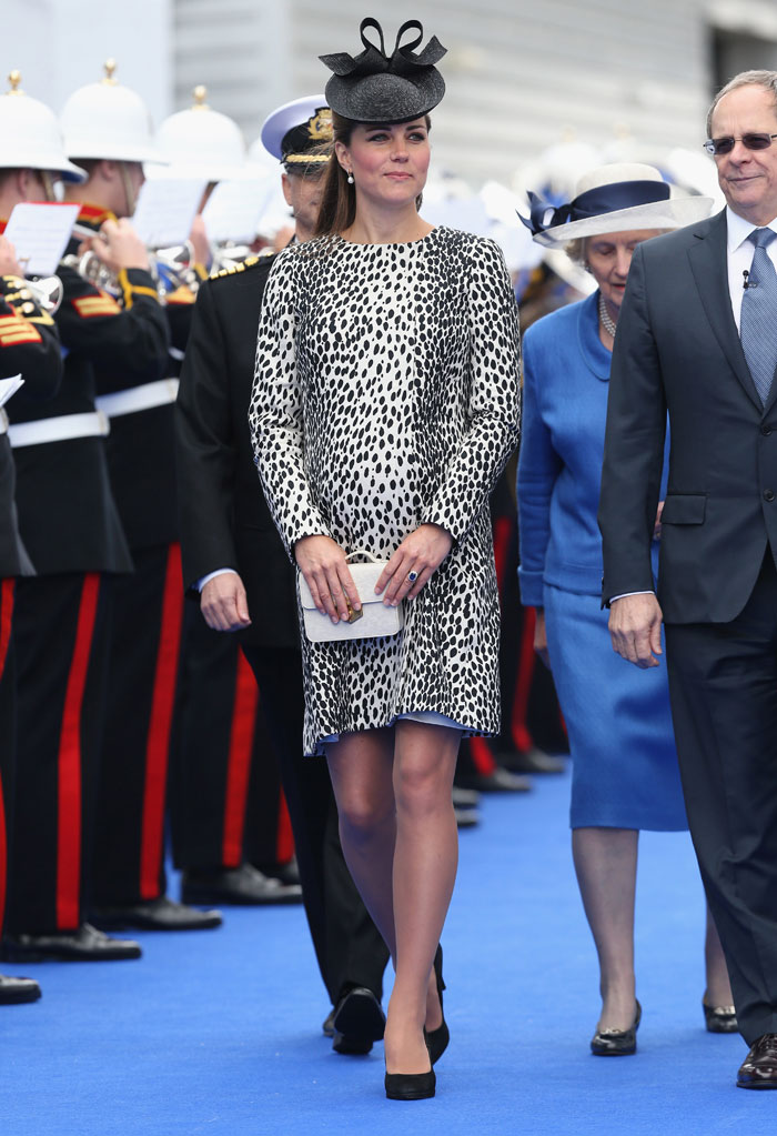 The pregnancy glow on her face, Kate looked lovely in a Dalmatian print coat which she accessorised with classic black court shoes.