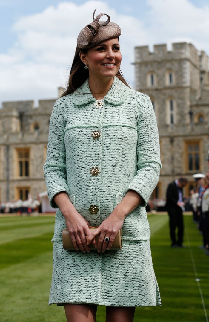 Kate Middleton attended the National Review of Queen's Scouts at Windsor Castle in Berkshire on April 21, 2013. The Duchess looked lovely in a mint green Mulberry coat worn with pink heels and a Whiteley hat.