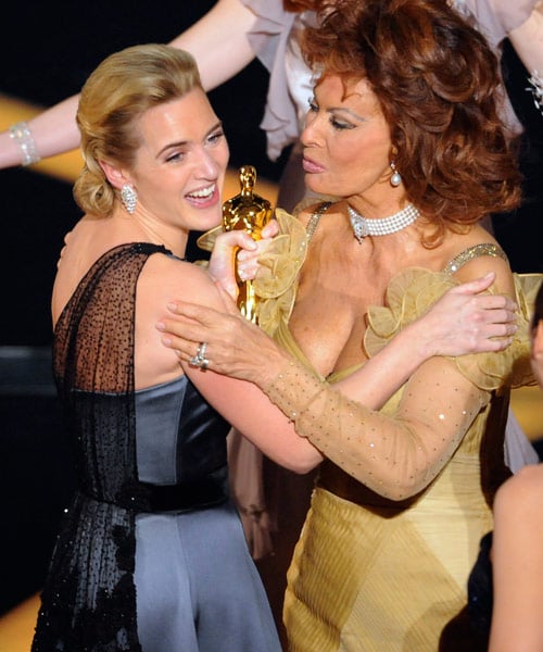 Winslet is congratulated by yesteryears actress Sophia Loren. Loren was one of the presenters of the Best Actress award.