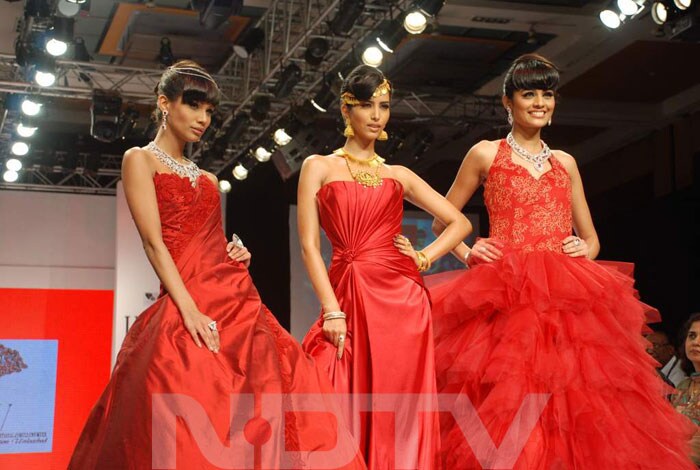 The three Miss India winners with the designers.