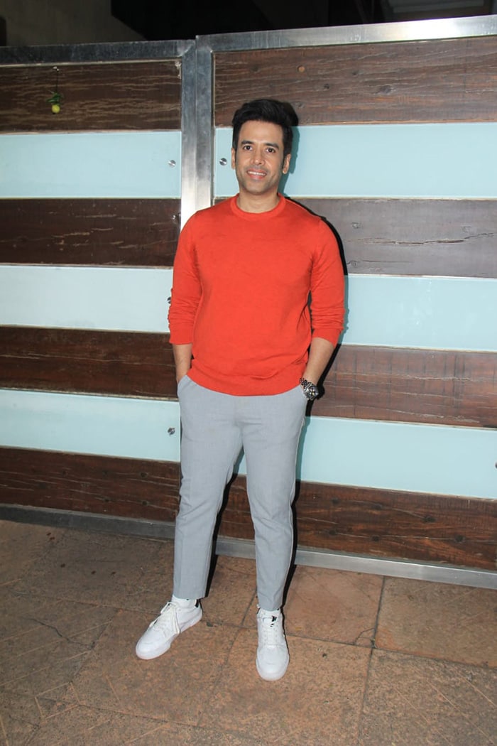 Tusshar Kapoor was photographed in Juhu in an orange t-shirt and a pair of jeans.