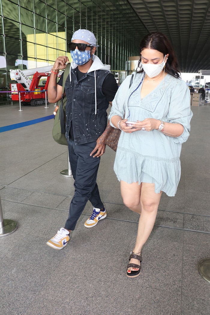 Remo D'Souza along with his wife Lizelle D'Souza were clicked at the Mumbai airport.