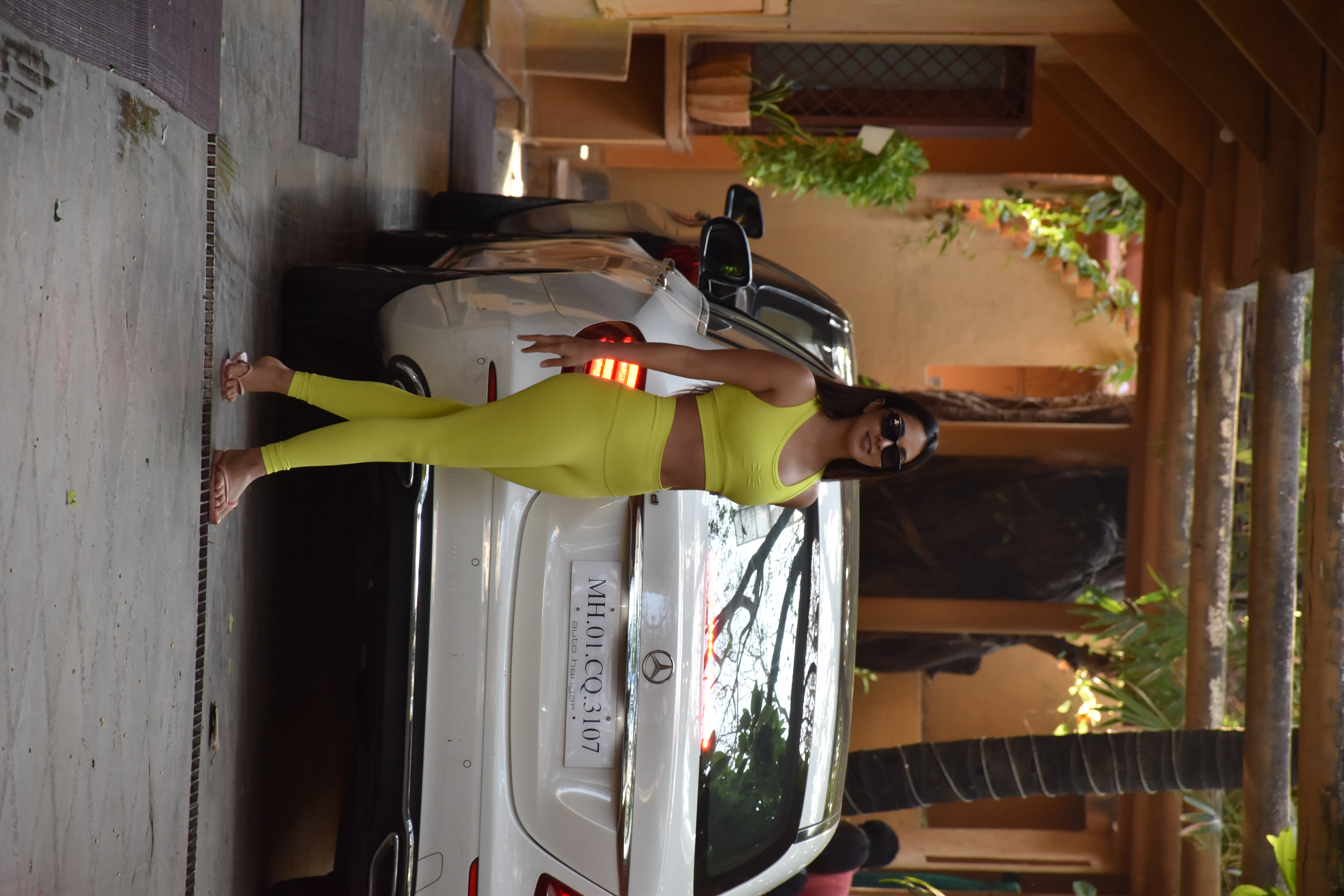 Kiara Advani was wearing yellow yoga pants with a matching top.