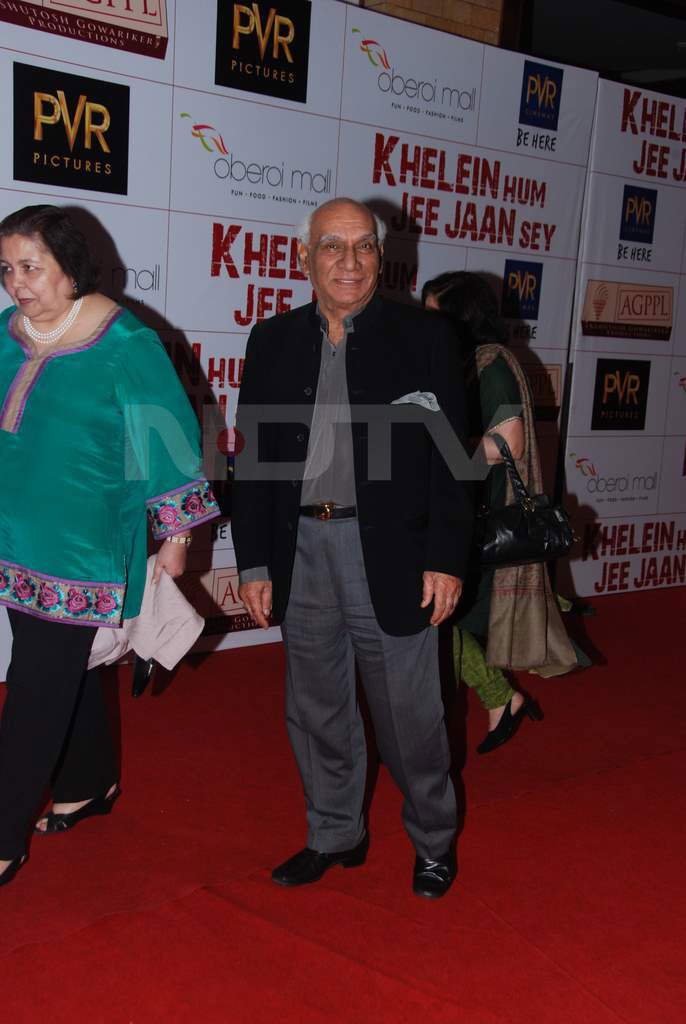 Yash Chopra waits for the camera to click him, but Pamela Chopra hurries up.