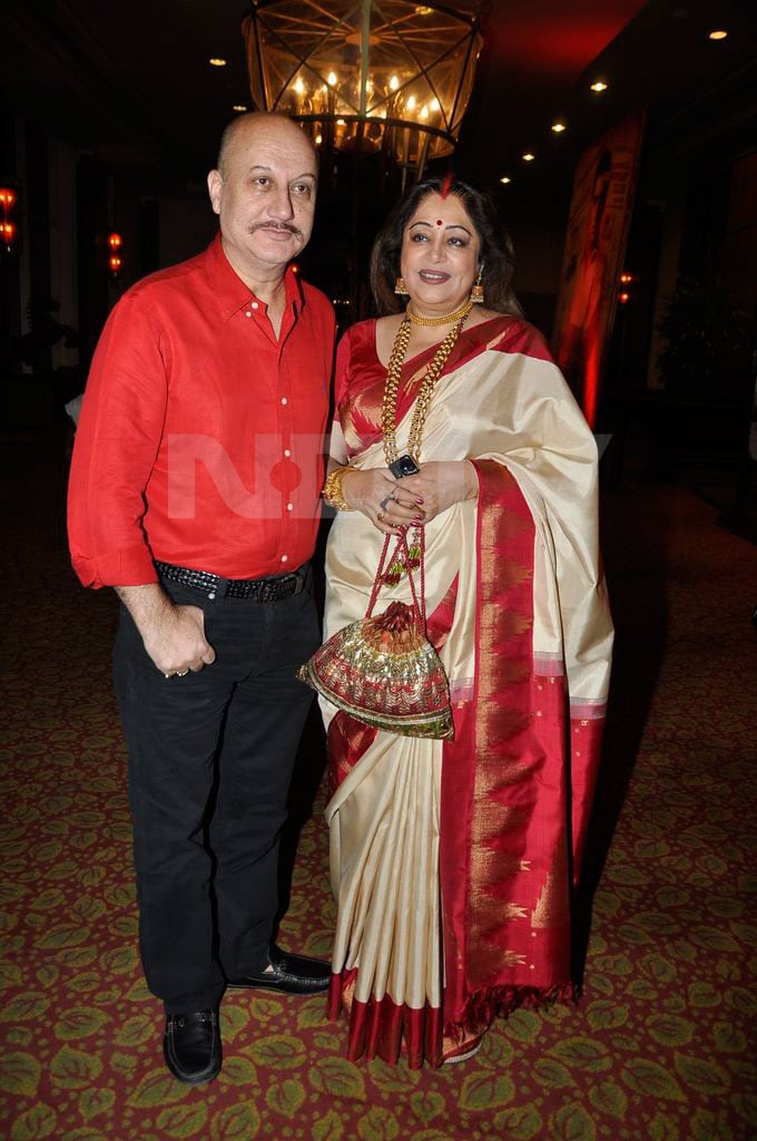 Anupam Kher and Kirron Kher stand colour co-ordinated.