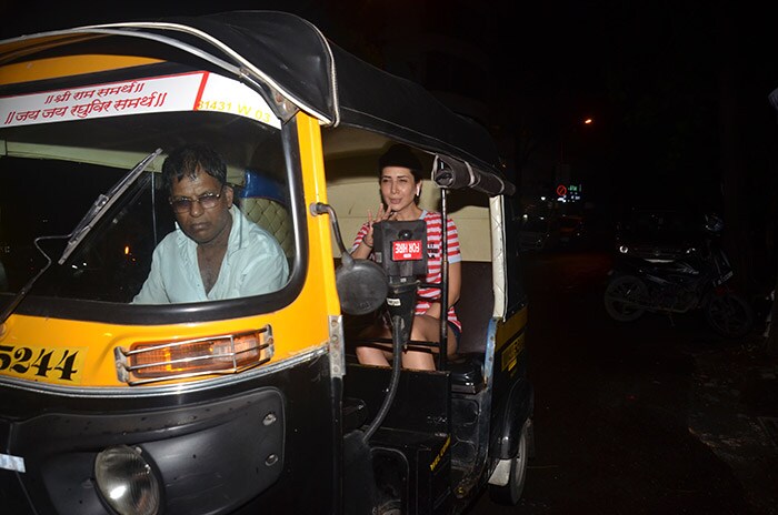 Kim Sharma Enjoys An Auto Ride On Bandra Street